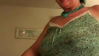 Older Woman Receives Facial From Younger Man